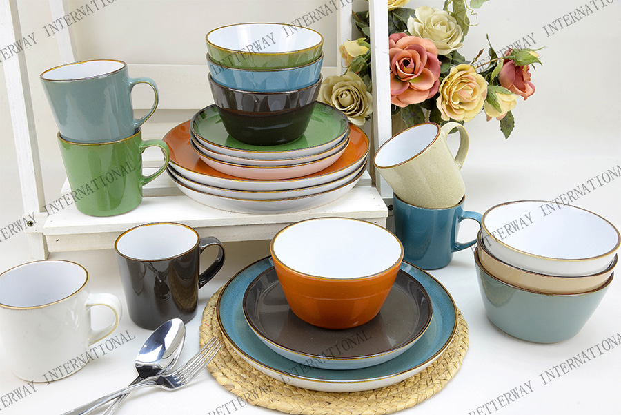 Stoneware dinnerware inside white outside with reactive glaze with brown rim