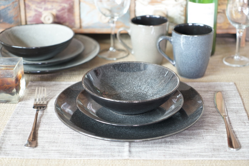 Stoneware dinnerware with reactive glaze & white speckle pattern