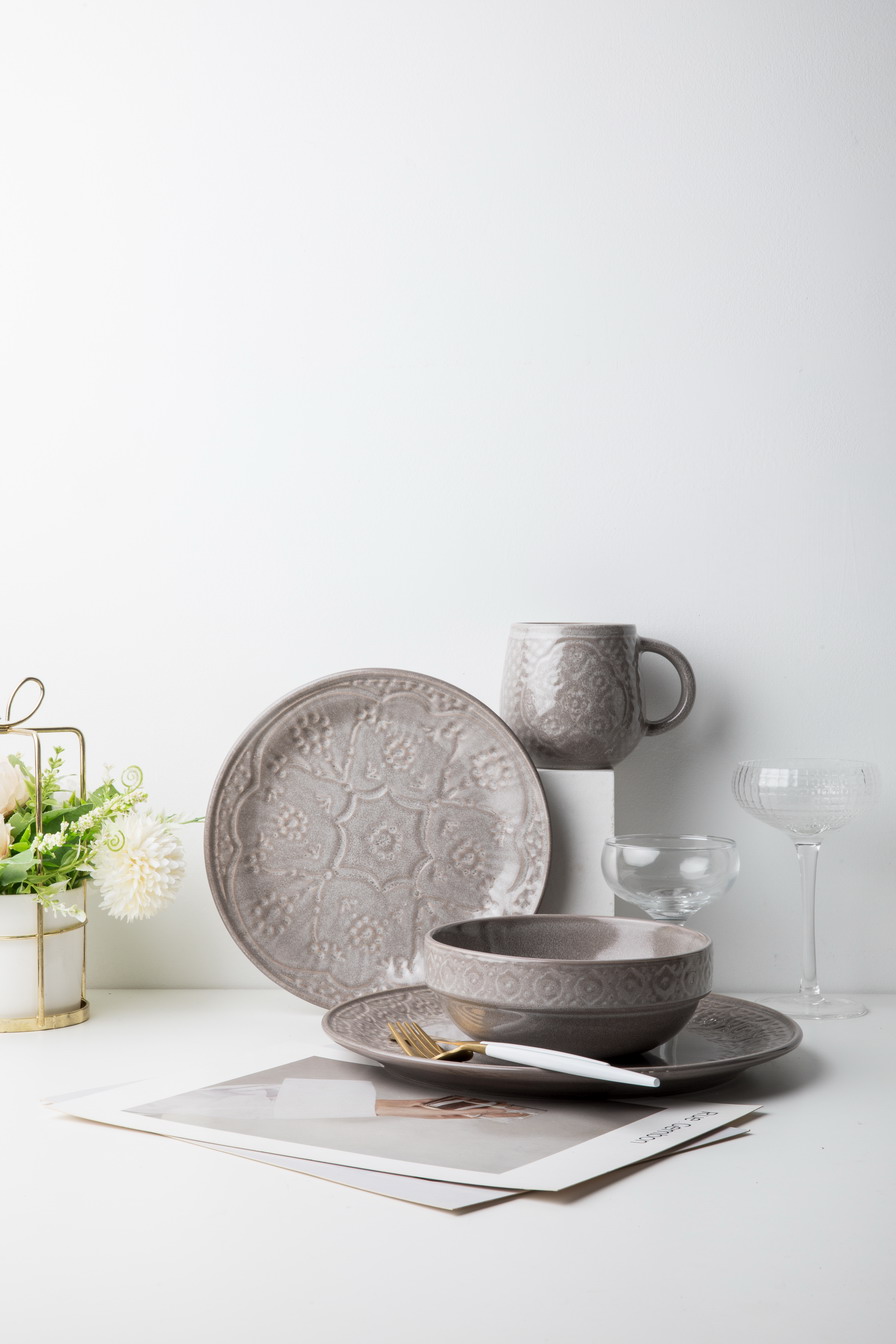 Stoneware reactive glaze dinnerware set embossed pattern